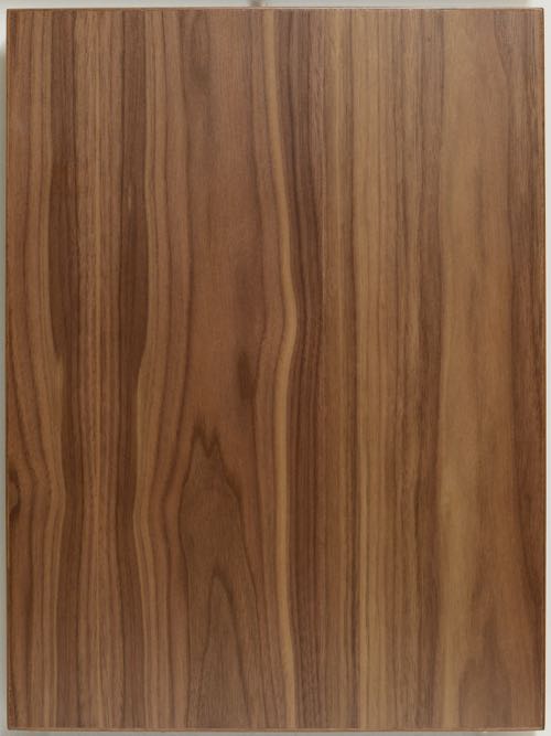 Walnut Flat Cut veneer slab style cabinet door with solid edge.